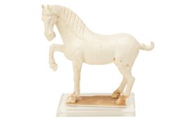 A WHITE GLAZED MODEL OF A HORSE