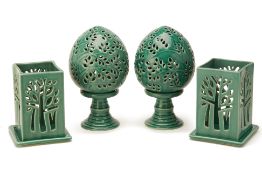 TWO PAIRS OF GREEN GLAZED CANDLE HOLDERS