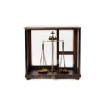 A SET OF INDIAN BALANCE SCALES IN GLAZED CASE