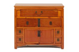 A CHINESE STYLE CHEST OF DRAWERS