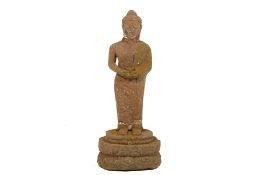 A STONE STANDING BUDDHA