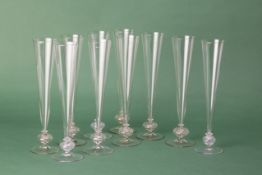 A SET OF TEN CHAMPAGNE FLUTES