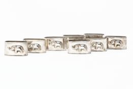 A SET OF EIGHT SILVER PLATED ELEPHANT NAPKIN RINGS