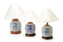 THREE BLUE AND WHITE PORCELAIN TABLE LAMPS