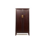 A TALL CHINESE BROWN LACQUER CABINET