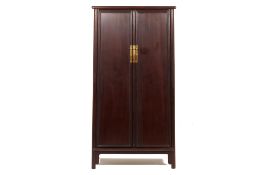 A TALL CHINESE BROWN LACQUER CABINET