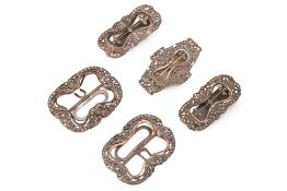 A GROUP OF FIVE WHITE METAL BUCKLES (2)