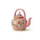 A PERANAKAN PINK-GROUND TEAPOT WITH AN ARCHED HANDLE