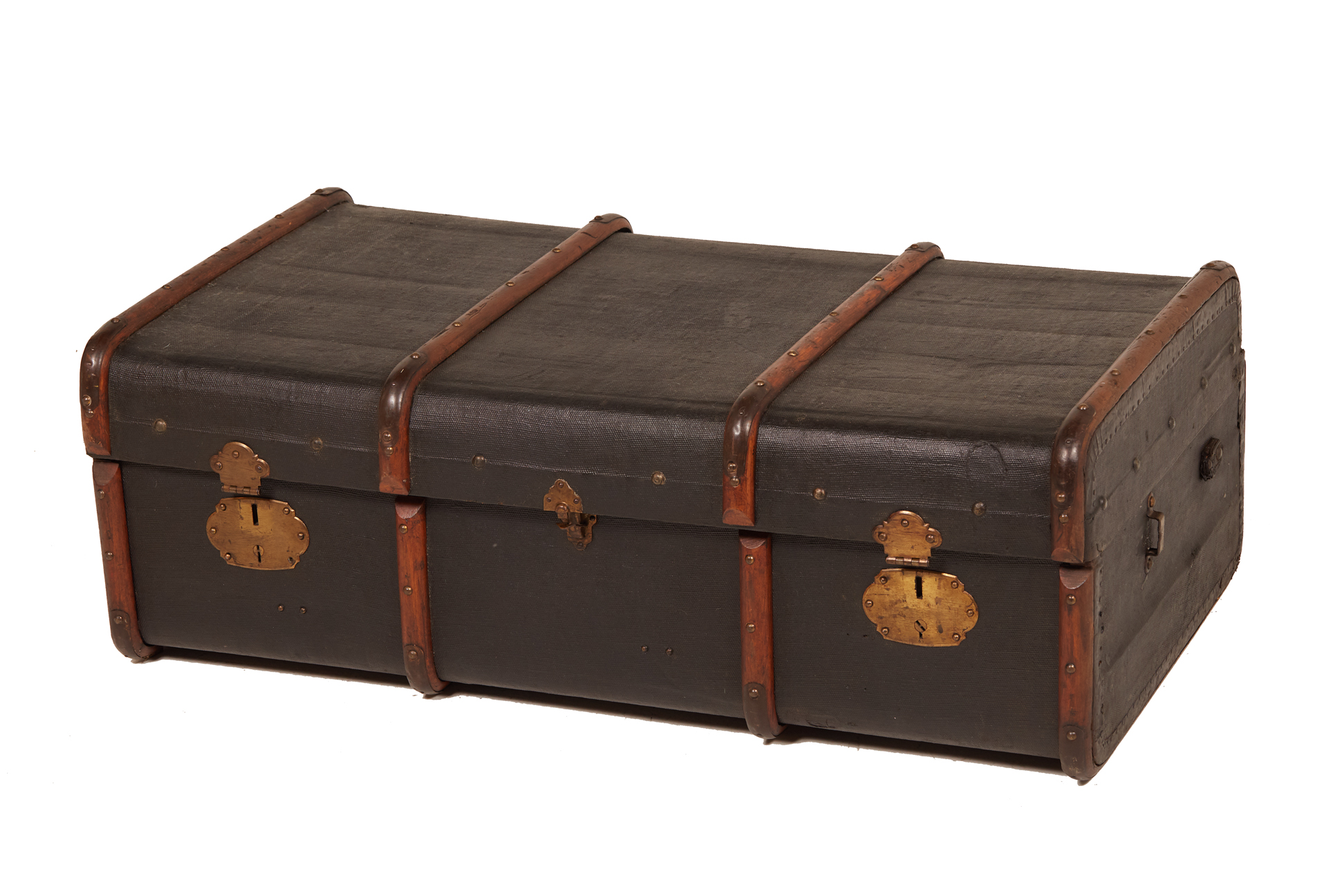 A LARGE VINTAGE BLACK BRASS & BOUND CANVAS TRAVELLING TRUNK