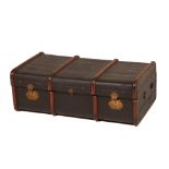 A LARGE VINTAGE BLACK BRASS & BOUND CANVAS TRAVELLING TRUNK