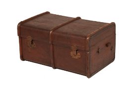 A LARGE VINTAGE BRASS AND BOUND CANVAS TRAVELLING TRUNK