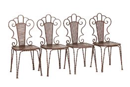 A SET OF FOUR WROUGHT IRON BISTRO CHAIRS