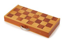 A FOLDING WOODEN CHESSBOARD AND PIECES
