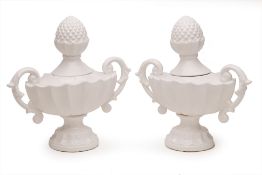 A PAIR OF TWIN HANDLED CERAMIC URNS