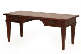 A LARGE OAK WRITING DESK