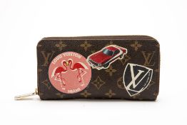 A LOUIS VUITTON "WORLD TOUR" MONOGRAM WALLET