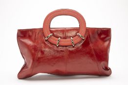 A KATE SPADE CORAL RED PATENT LEATHER HANDBAG