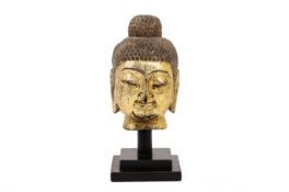 A GILT DECORATED BUDDHA HEAD