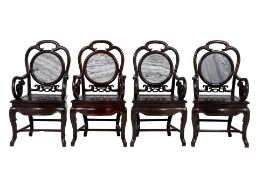 A SET OF FOUR BLACKWOOD ARMCHAIRS