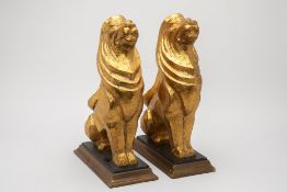 A PAIR OF GILTWOOD MODELS OF LION