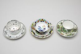 THREE ANTIQUE TEA CUPS AND SAUCERS