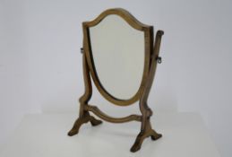 A SMALL SHIELD SHAPE SWING DRESSING TABLE MIRROR