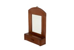 A WALL MIRROR WITH DRAWER
