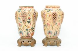 A PAIR OF ZSOLNAY PECS GILT METAL MOUNTED VASES