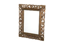 A LARGE GILTWOOD CARVED WALL MIRROR