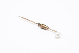 A PEARL AND YELLOW METAL TIE PIN