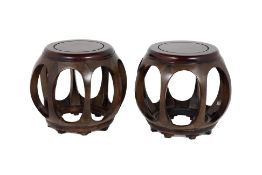 A PAIR OF ORIENTAL HARDWOOD STOOLS