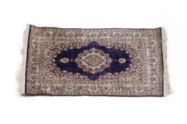 A SMALL TURKISH SILK RUG