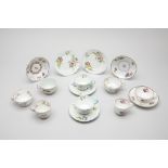 A GROUP OF EUROPEAN FLORAL DECORATED TEA CUPS AND SAUCERS