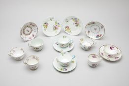 A GROUP OF EUROPEAN FLORAL DECORATED TEA CUPS AND SAUCERS