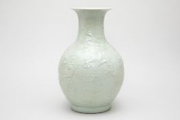 A CELADON GLAZED DRAGON VASE