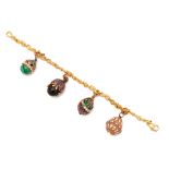 A GOLD ENAMEL AND DIAMOND CHARM BRACELET