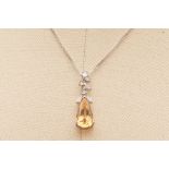 A CITRINE AND DIAMOND PENDANT ON CHAIN