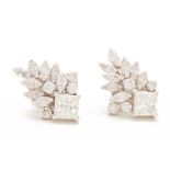 A PAIR OF DIAMOND CLUSTER EARRINGS