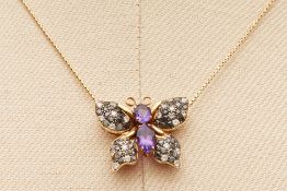 AN AMETHYST AND DIAMOND BUTTERFLY PENDANT ON CHAIN