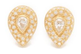 A PAIR OF PEAR SHAPED DIAMOND STUD EARRINGS