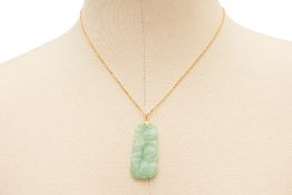 A CARVED JADE PENDANT ON CHAIN