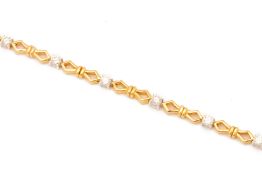 A TWO-COLOUR GOLD AND DIAMOND BRACELET