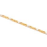 A TWO-COLOUR GOLD AND DIAMOND BRACELET