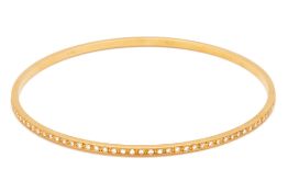 A GOLD AND DIAMOND BANGLE