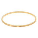 A GOLD AND DIAMOND BANGLE