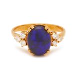 A BLACK OPAL AND DIAMOND RING