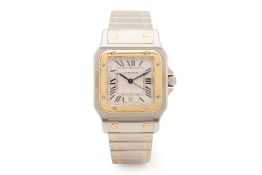 A CARTIER SANTOS STAINLESS STEEL AND GOLD BRACELET WATCH