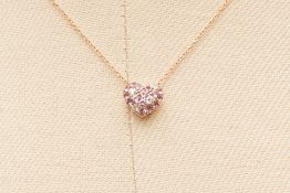 A PINK SAPPHIRE AND DIAMOND HEART SHAPED PENDANT ON CHAIN