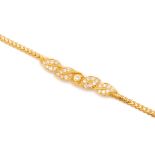 A GOLD AND DIAMOND BRACELET