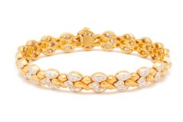 A TWO-COLOUR GOLD AND DIAMOND BRACELET